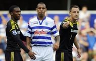 Queens Park Rangers' defender Anton Ferdinand (2nd L) is seen with Chelsea's defender John Terry (R)